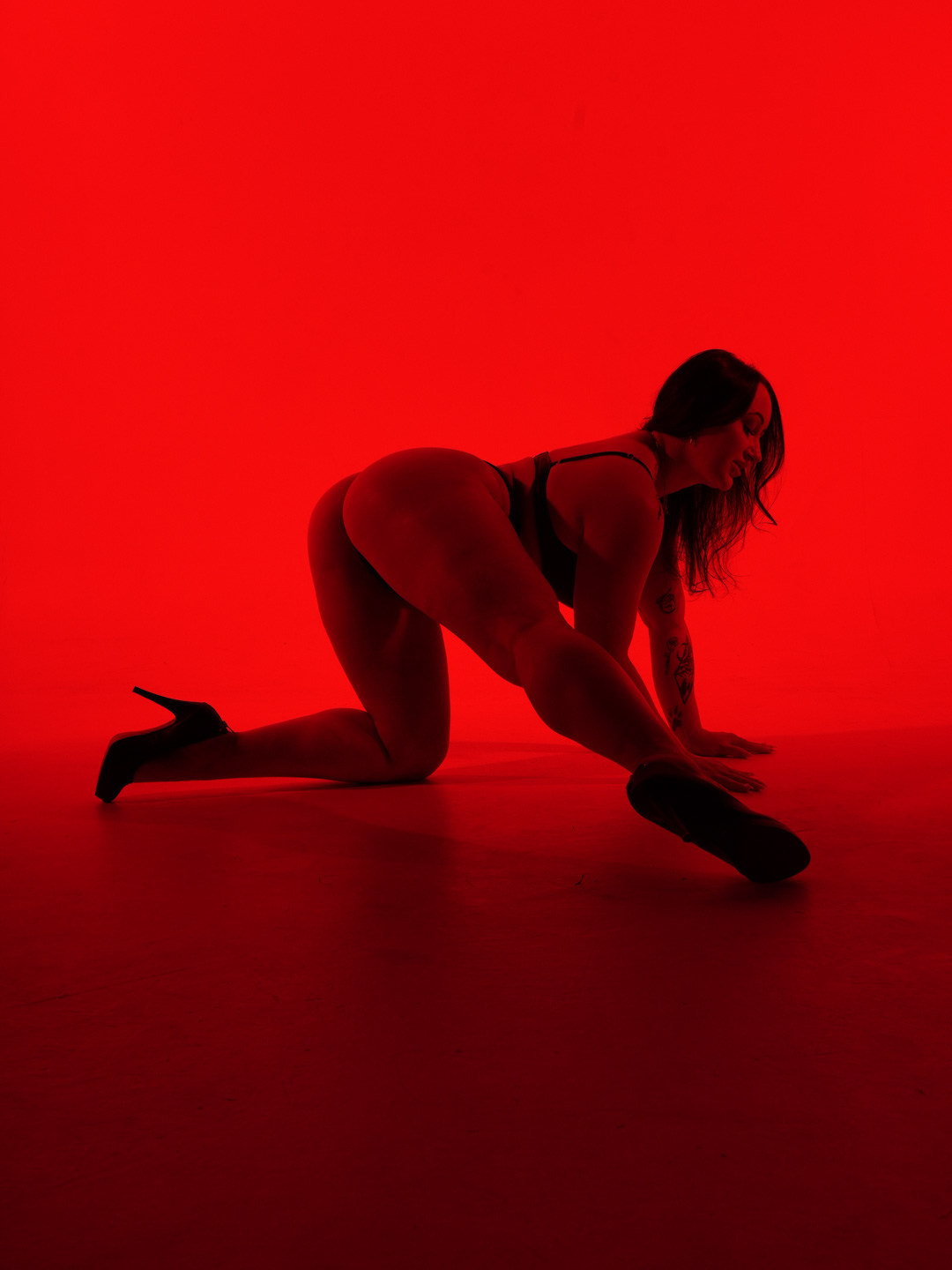 Paige Jade fully framed in a grounded heels dance pose